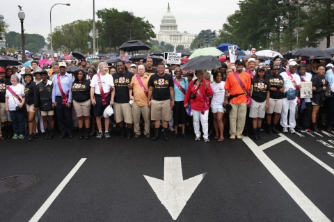 People march from Capitol Hill to the Lincoln Memorial honoring the 50th anniversary of the historic March on Washington (Chip Somodevilla/Getty Images)